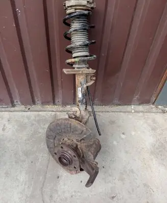 Volkswagen Golf V Front shock absorber with coil spring 1K0413031BF