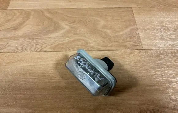 Toyota Avensis T250 Number plate light E1001479