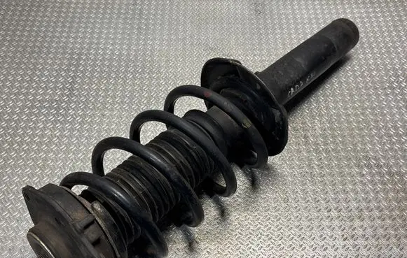 Volkswagen Caddy Front shock absorber with coil spring