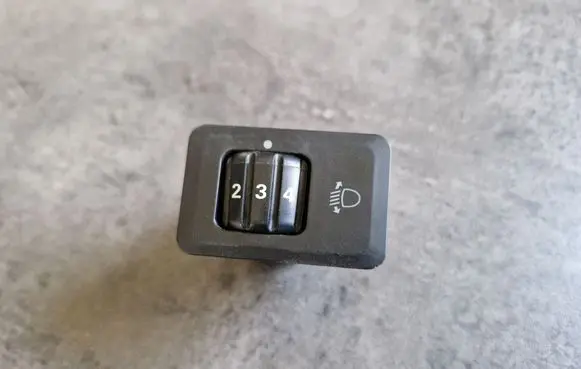Headlight level height control switch