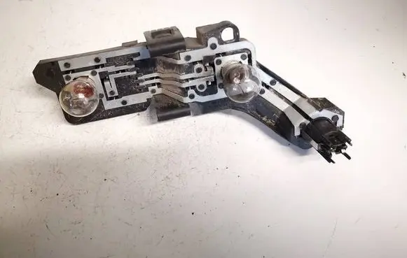 Tail light bulb cover holder
