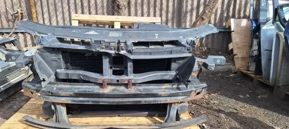 Radiator support slam panel