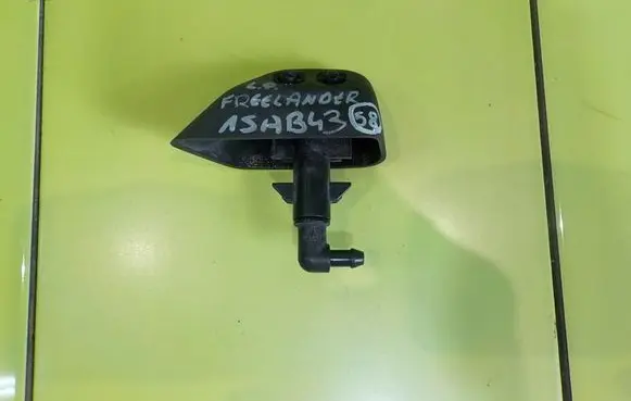 Land Rover Freelander 2 - LR2 Headlight washer pump LEWY