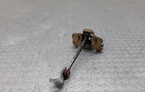 Front door check strap stopper