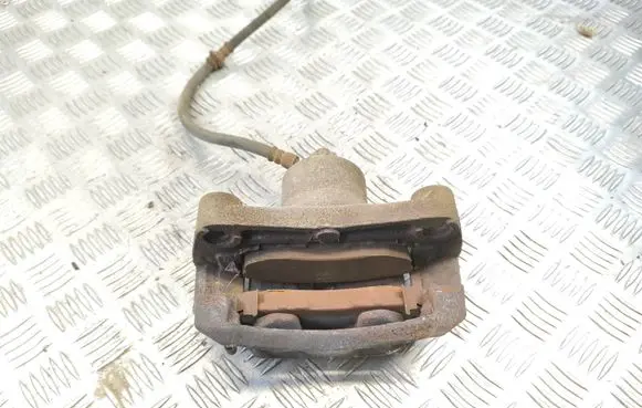 Nissan Juke I F15 Front brake caliper