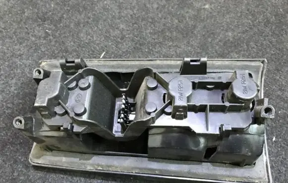 Tail light bulb cover holder