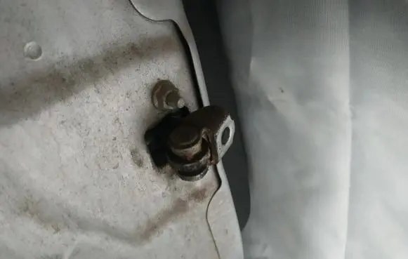 Rear door check strap stopper