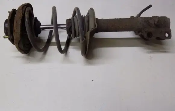 Nissan X-Trail T30 Front shock absorber with coil spring 789423jklweu2
