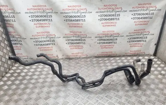 Volkswagen Touran I Engine coolant pipe/hose 03G121151AE
