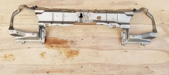 Top upper radiator support slam panel