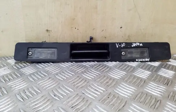 Trunk door license plate light bar