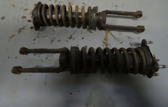 Jeep Cherokee Front shock absorber with coil spring AMORTYZATORKJ