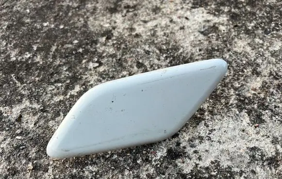 Headlight washer spray nozzle cap/cover
