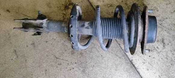 Subaru Impreza III Front shock absorber with coil spring