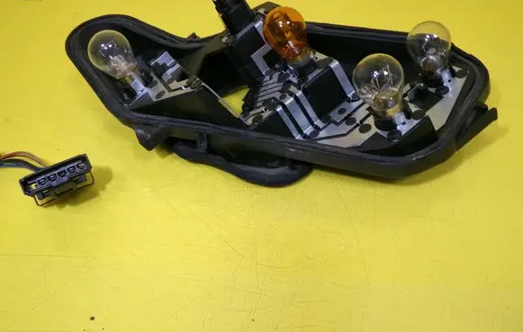 Opel Corsa D Tail light bulb cover holder 89037877A