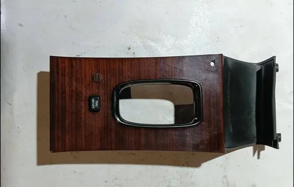 Cadillac DeVille Gear shifter surround trim plastic 25677097