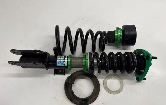 Ford Mustang VI Front shock absorber with coil spring R9HPX1210