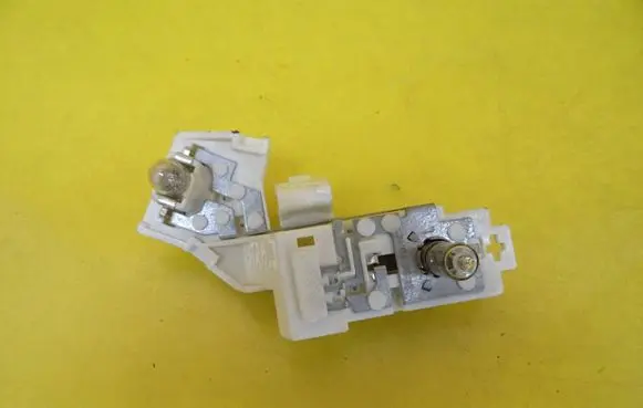 Opel Astra J Tail light bulb cover holder