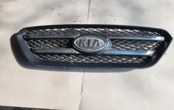 KIA Carens III Front bumper upper radiator grill 86380-10000