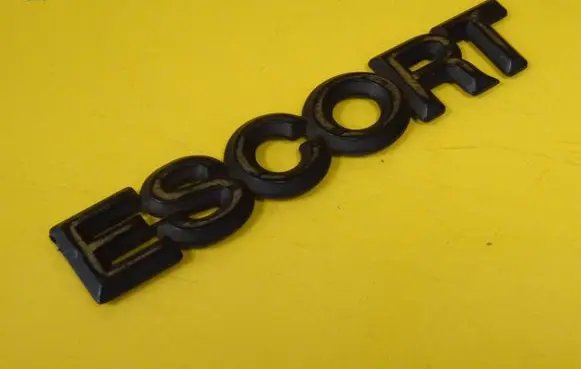 Ford Escort Manufacturers badge/model letters 