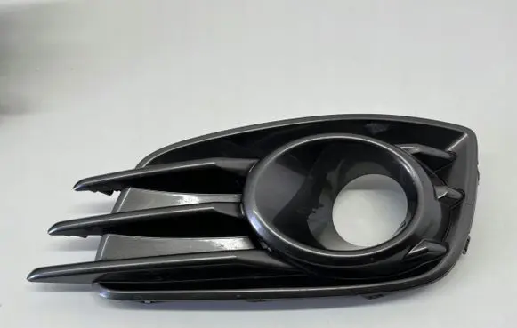 Suzuki Swift II Front fog light trim/grill 7176170L