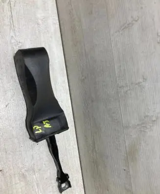 Front door check strap stopper