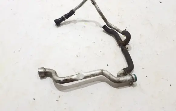 Volkswagen Touareg II Engine coolant pipe/hose 057121075AP