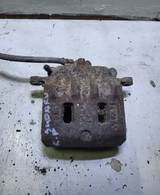 Subaru Forester SF Front brake caliper