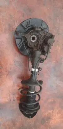 Subaru Impreza III Front shock absorber with coil spring 