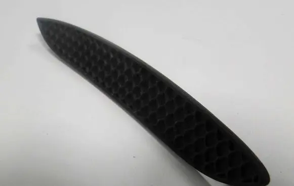 Rear bumper trim bar molding