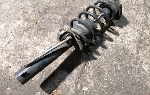 Front shock absorber with coil spring