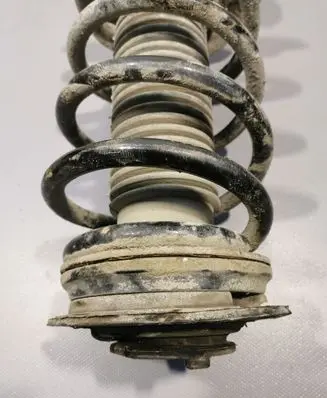 Nissan Qashqai+2 Front shock absorber with coil spring