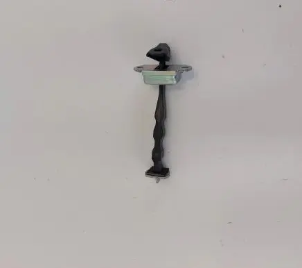 Front door check strap stopper