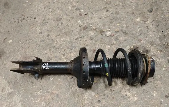 Subaru Outback Front shock absorber with coil spring 20310AJ080