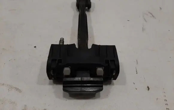 Rear door check strap stopper