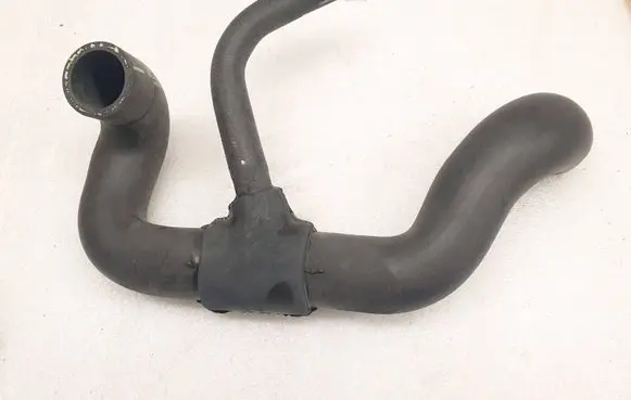 Opel Tigra A Engine coolant pipe/hose 9129484