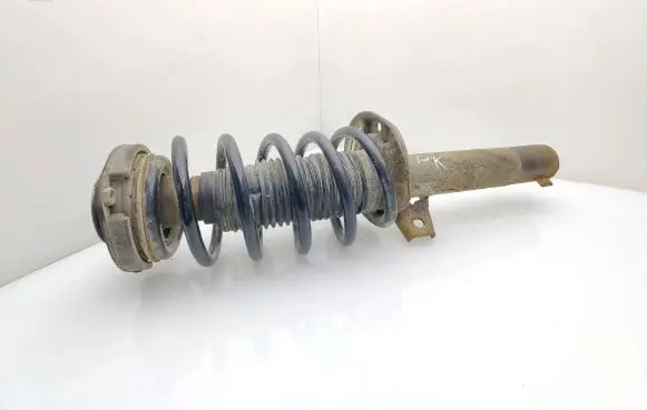 Volkswagen Caddy Front shock absorber with coil spring 2K0412021M