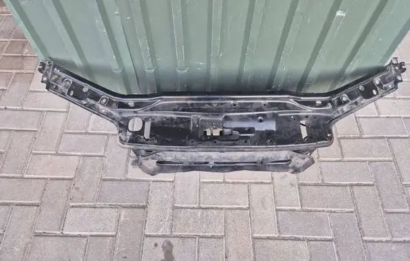 Top upper radiator support slam panel