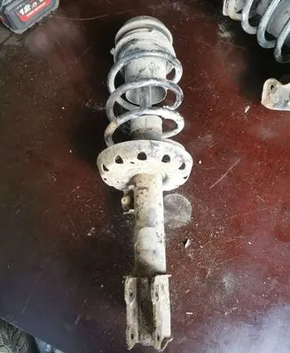 Front shock absorber with coil spring