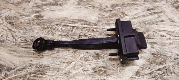 Front door check strap stopper