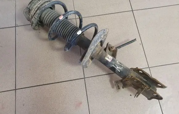 Nissan X-Trail T31 Front shock absorber with coil spring