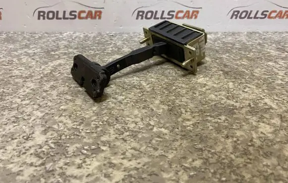Front door check strap stopper