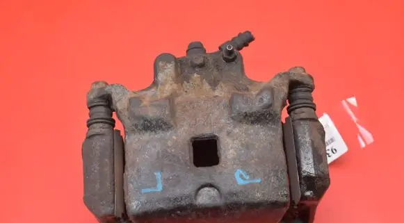 Nissan Juke I F15 Front brake caliper