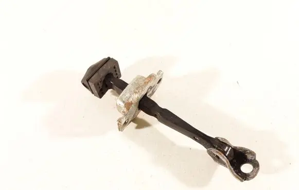 Front door check strap stopper