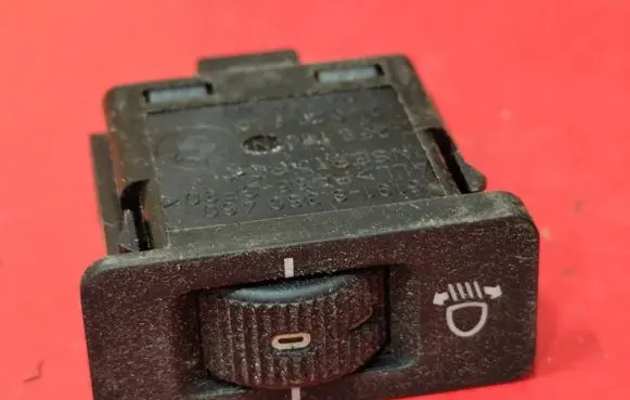 Headlight level height control switch