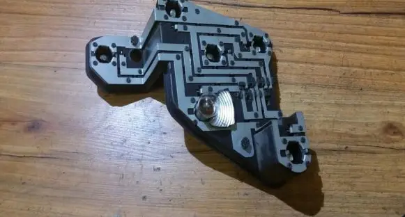 Tail light bulb cover holder