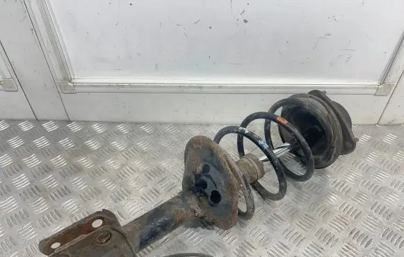 Front shock absorber with coil spring