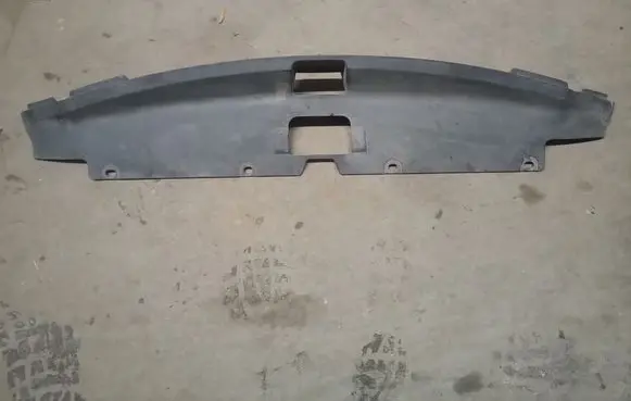 Engine bonnet/hood lock trim molding