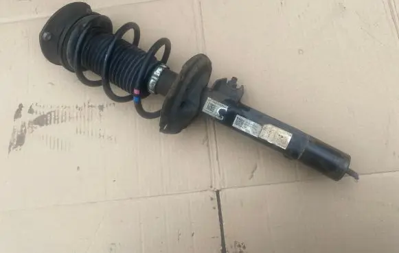 Front shock absorber with coil spring