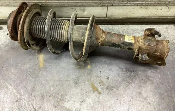 Subaru Legacy Front shock absorber with coil spring 20310AJ020